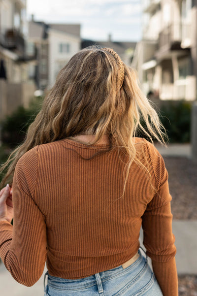 Back view of a brown bodysuit