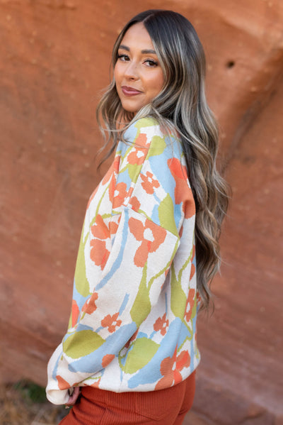 Side view of a floral sweater