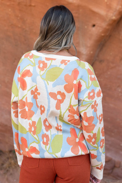 Back view of a floral sweater