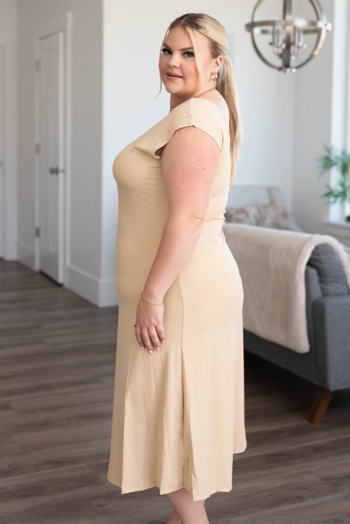 Side view of a plus size nude slipette midi cap sleeve