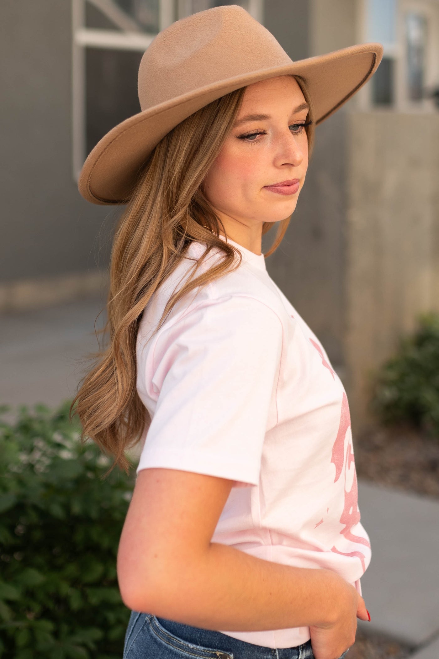 Side view of the world needs pink tee