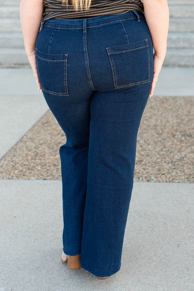 Back view of the plus size dark denim wide leg pants
