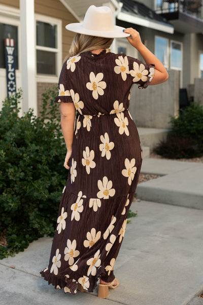 Back view of a brown floral dress