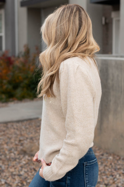 Side view of the taupe sweater
