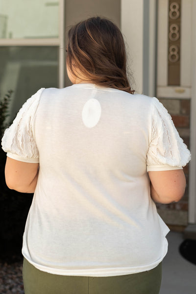 Back view of a plus size white top
