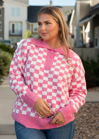 Pink pullover top with pink collar and cuffs