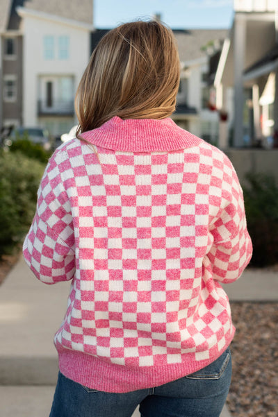 Back view of a pink pullover top