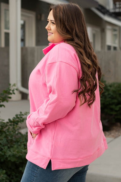 Side view of a long sleeve pink pullover