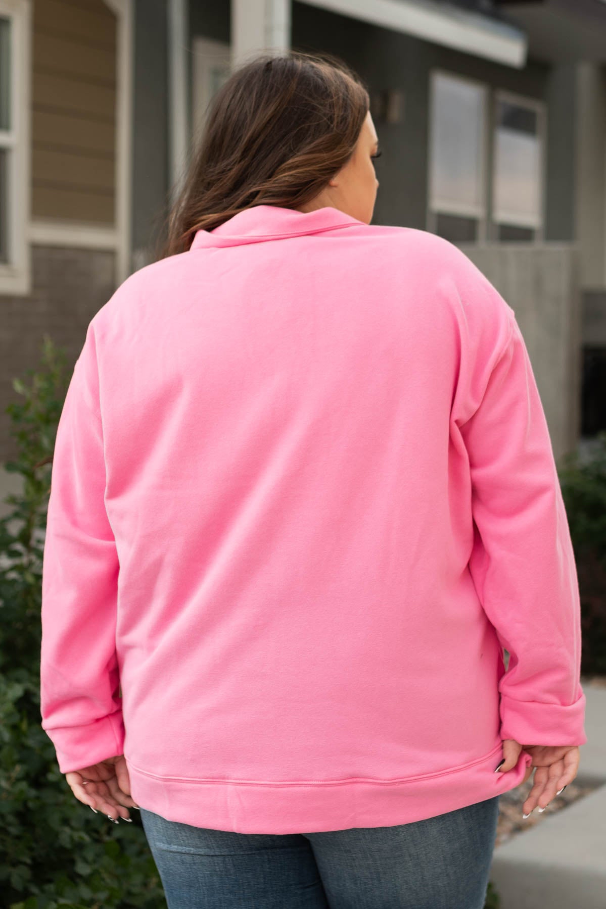 Back view of a plus size long sleeve pink pullover
