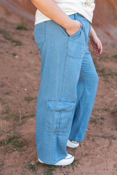 Side view of denim pants with side pockets