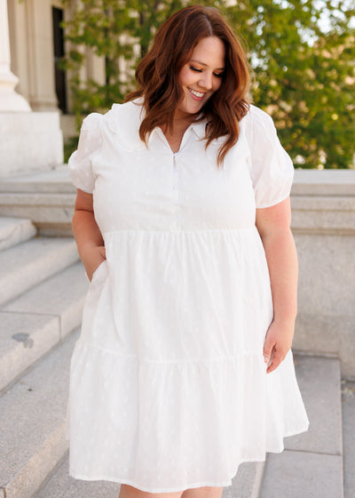 Plus size ivory mini dress with short sleeves and pockets