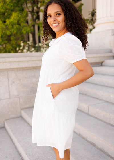 Side view of the ivory mini dress with pockets