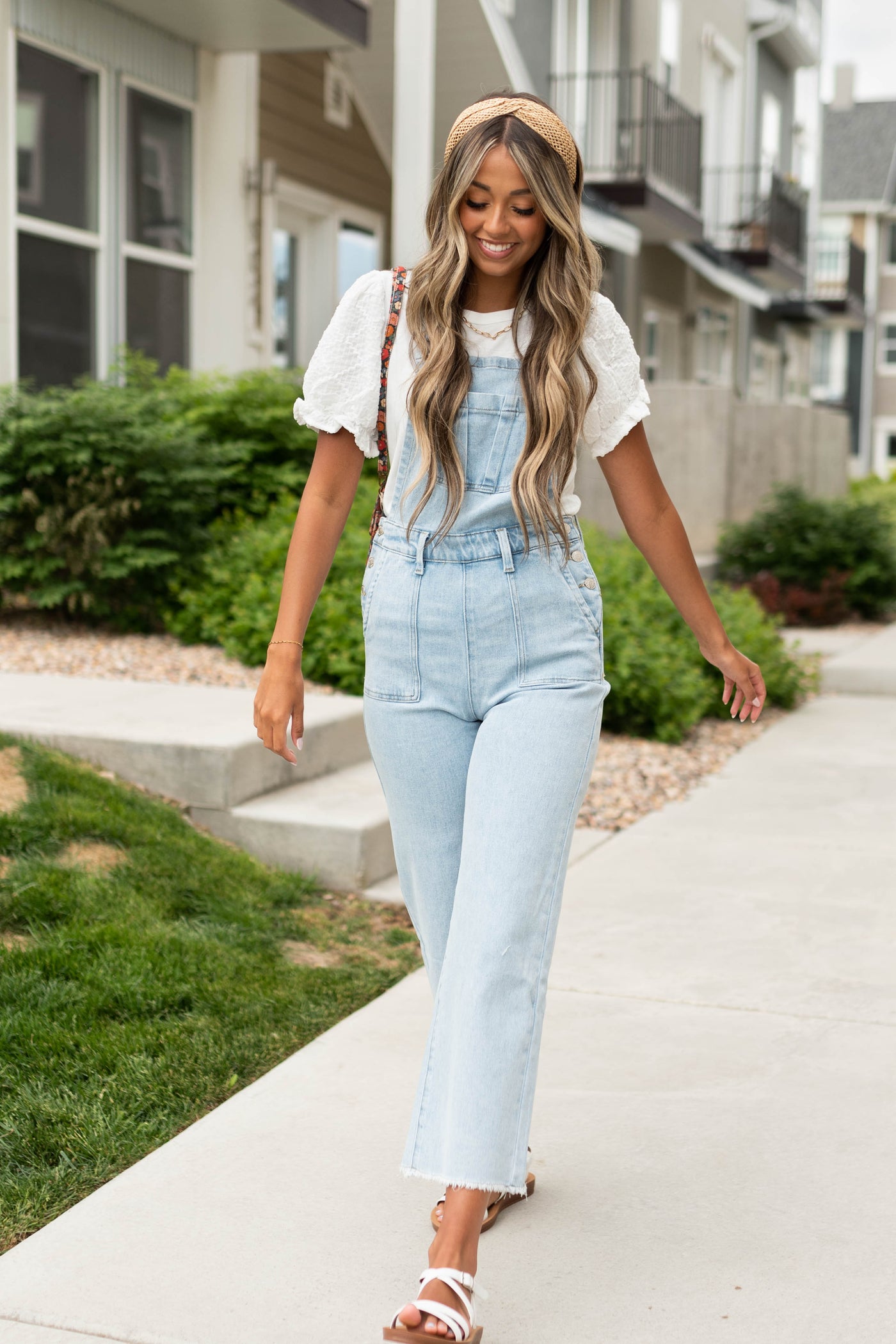 Light denim overalls with frayed hem and pockets