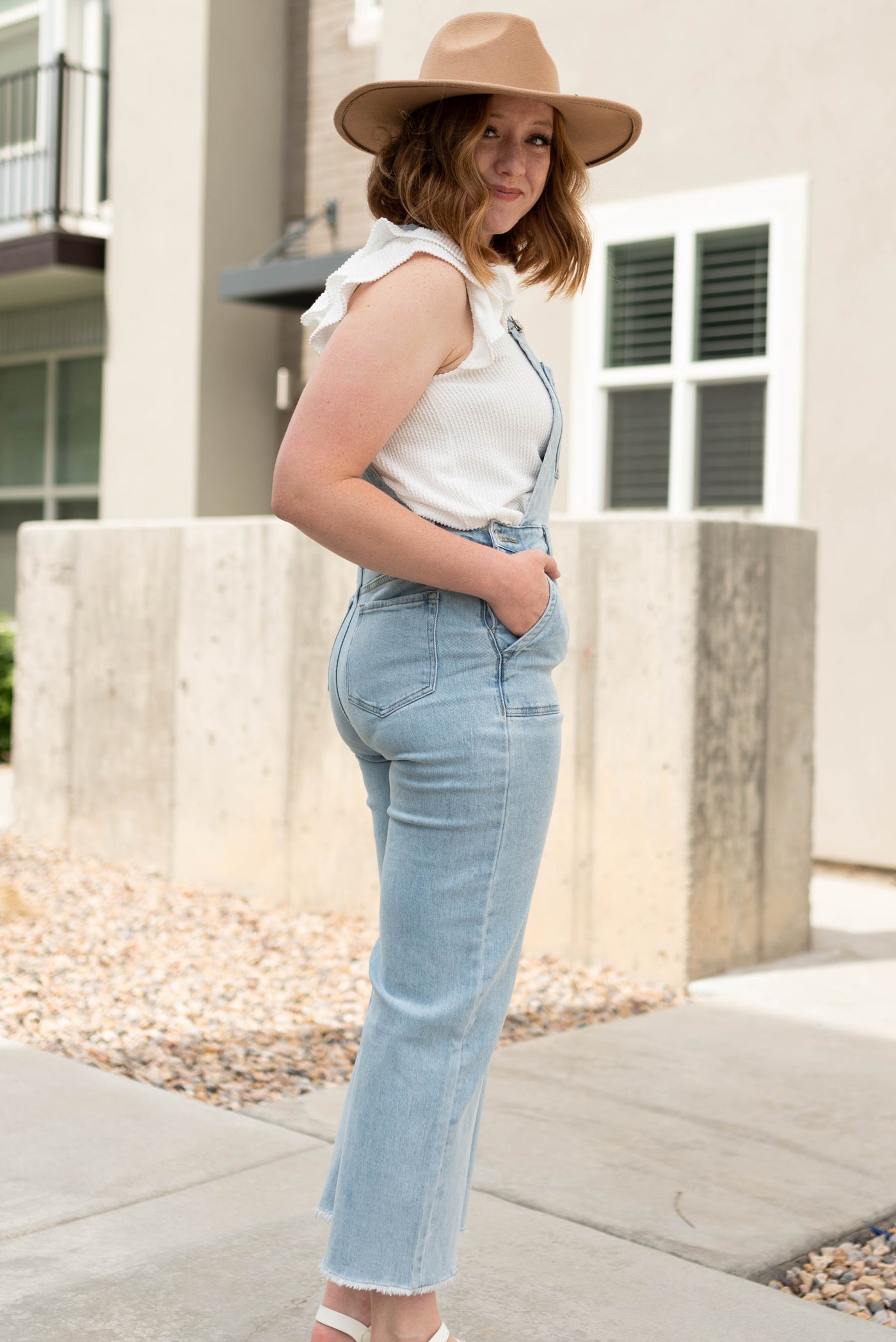 Side view of light denim overalls