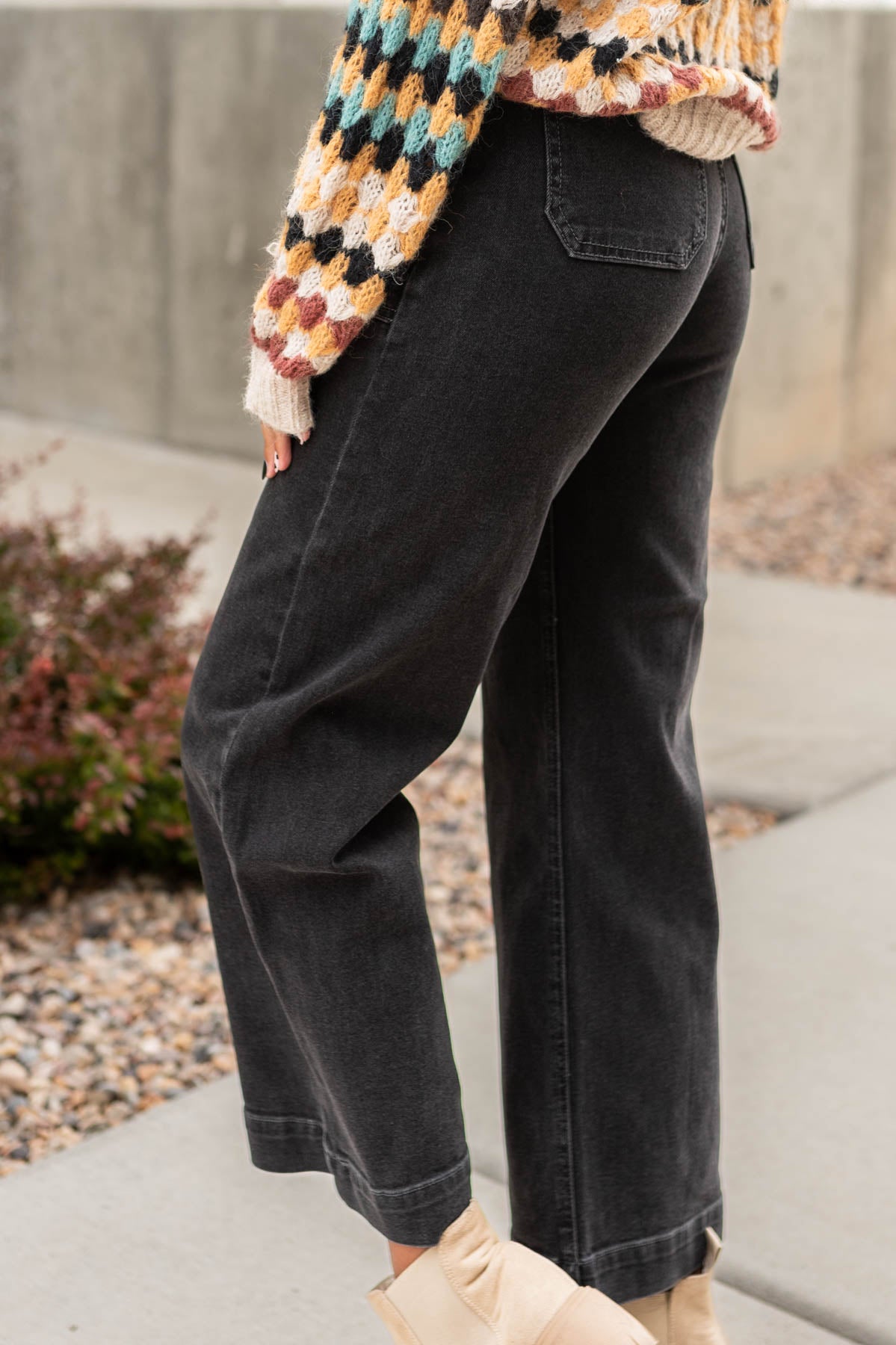 Side view of wide leg black jeans