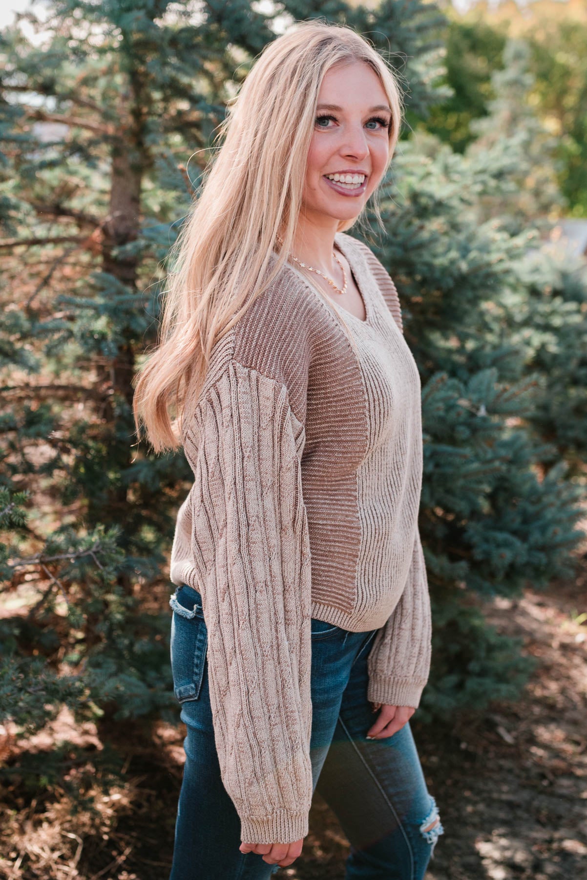 Side view of the taupe sweater