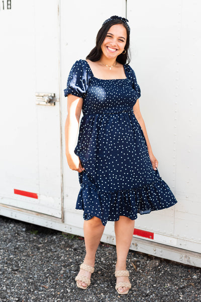 Front view of a navy square neck dress with short sleeve 