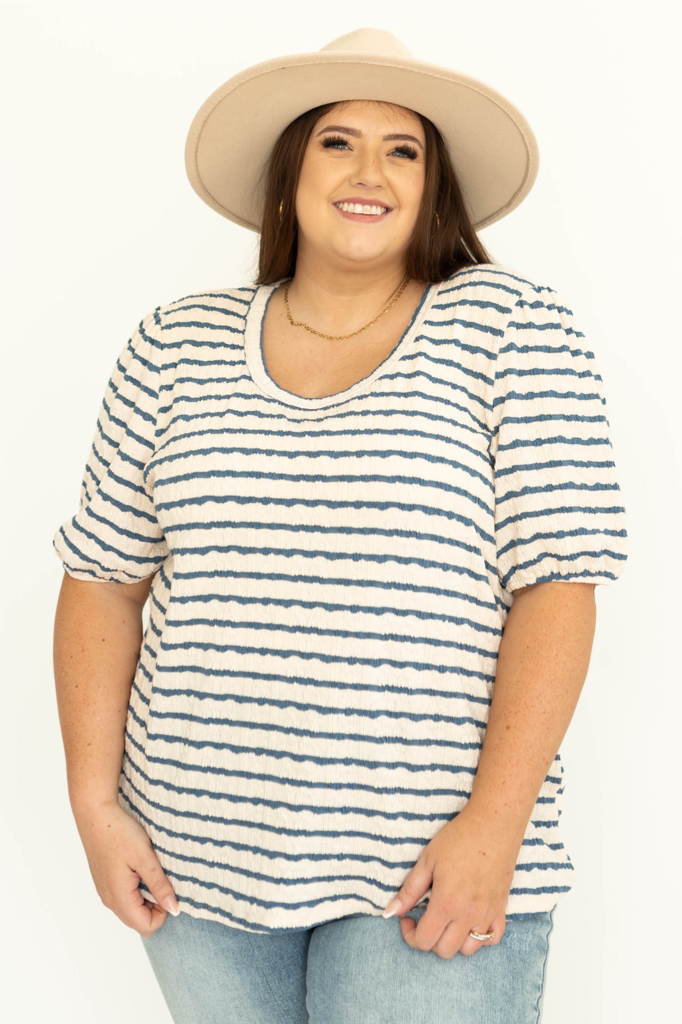 Front view of a blue striped top with full sleeves