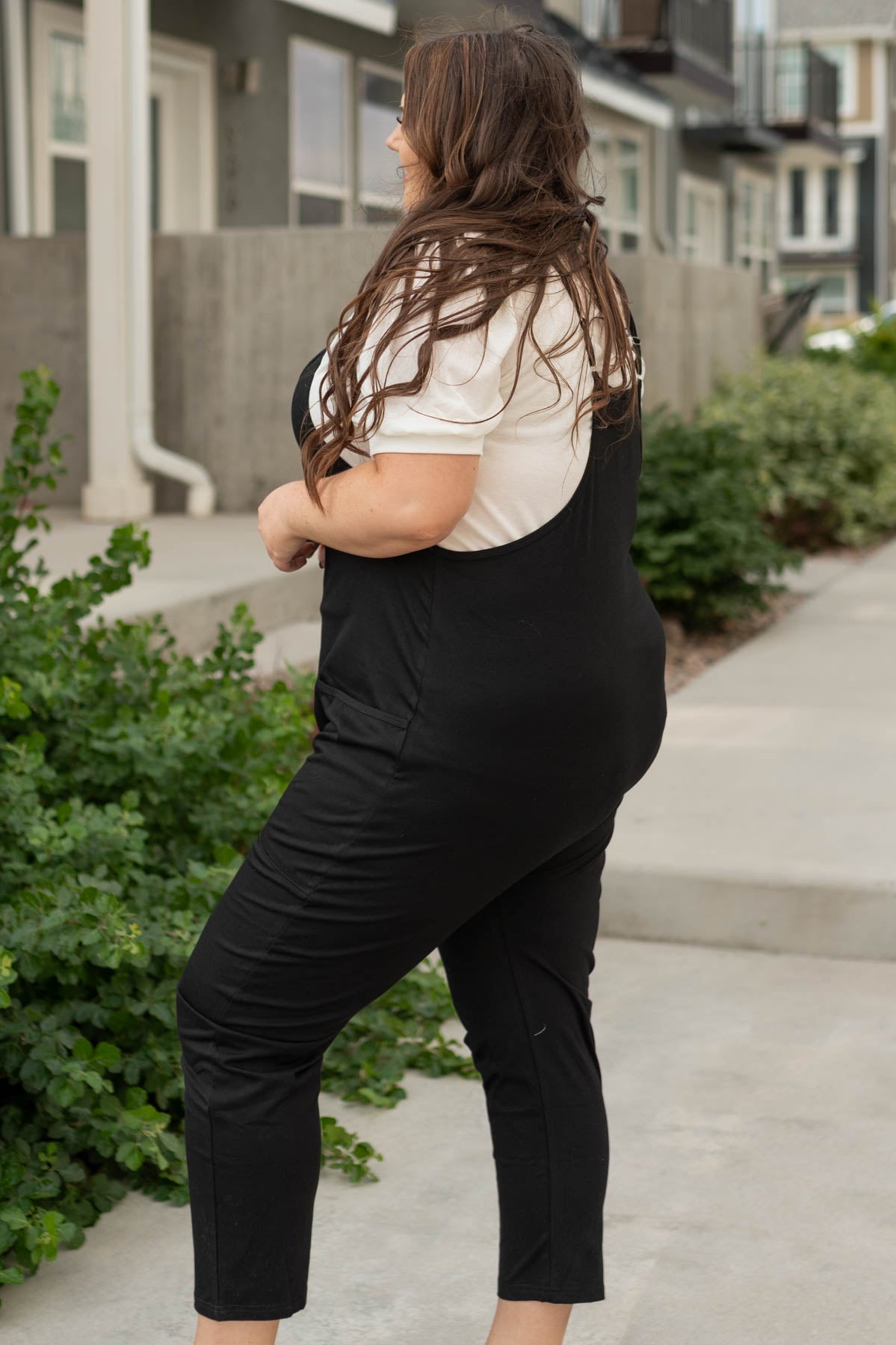 Side view of a plus size jumpsuit