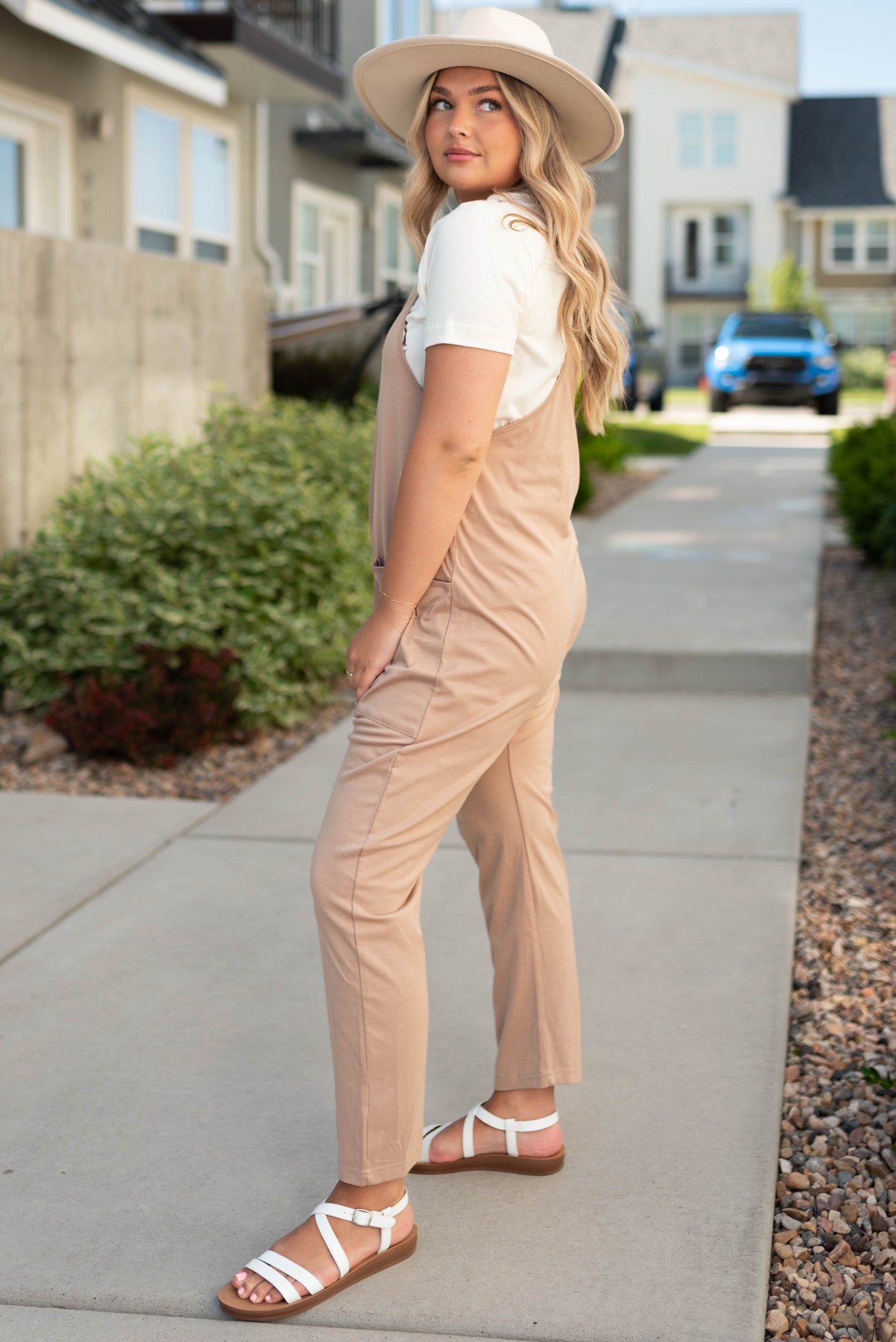Side view of a taupe jumpsuit