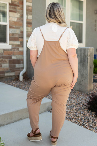 Back view of a plus size taupe jumpsuit