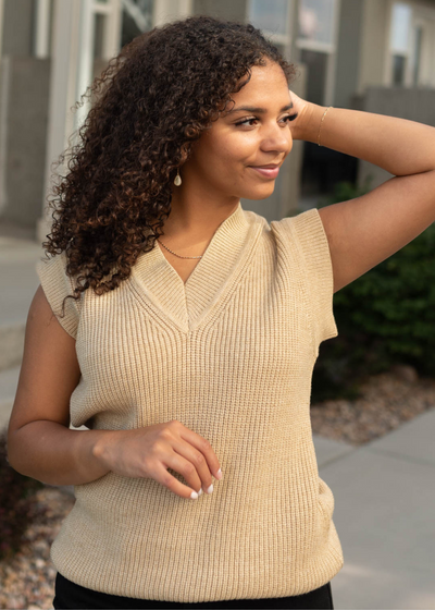 Camel sweater vest with banding around the arm