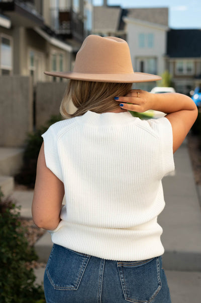 Back view of a white sweater vest