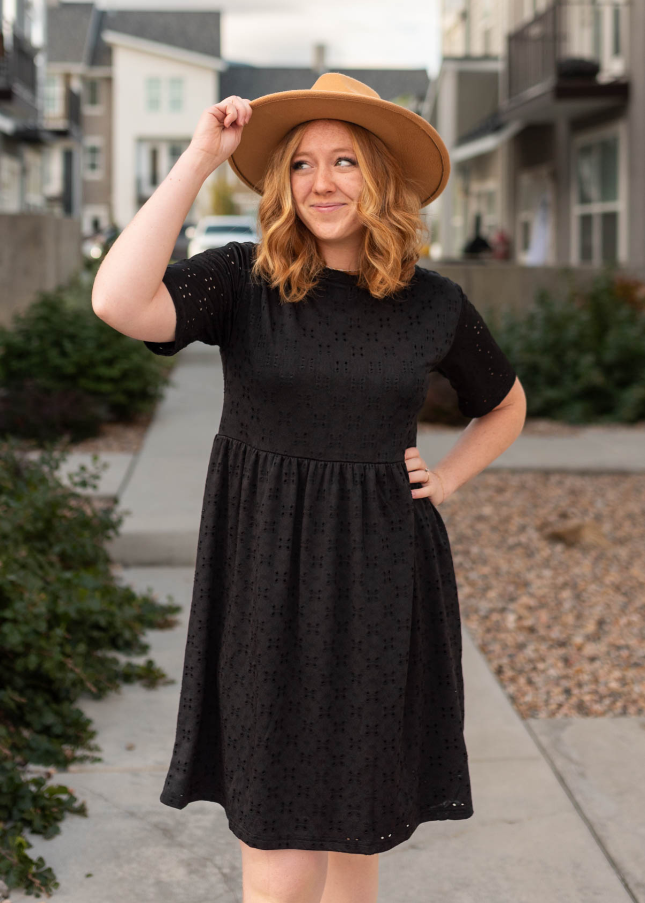 Short sleeve black eyelet dress with a high waist