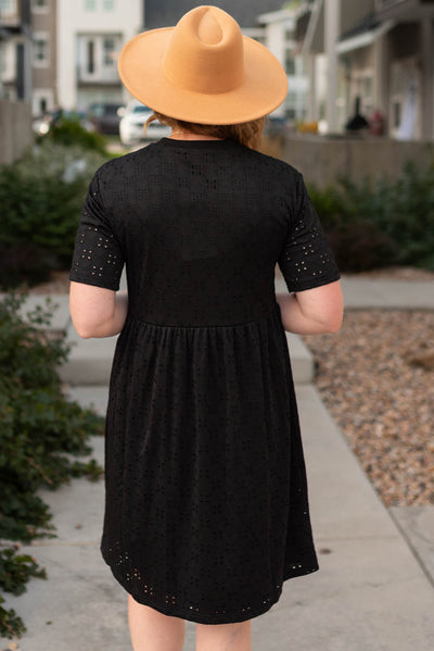 Back view of a black eyelet dress