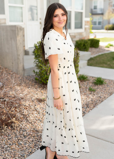 Side view of the ivory embroidered dress