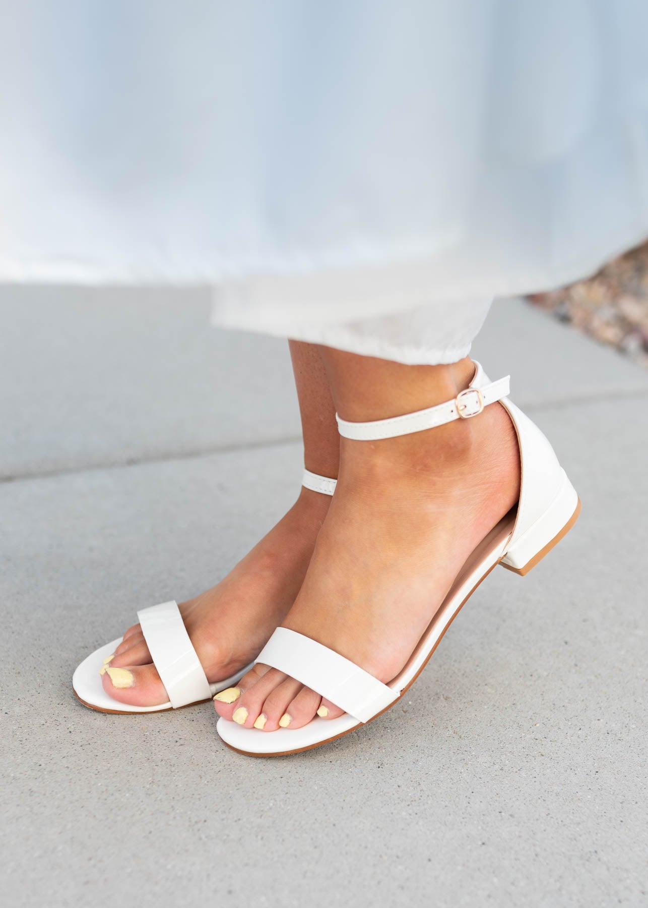 Side view of the white dress shoes