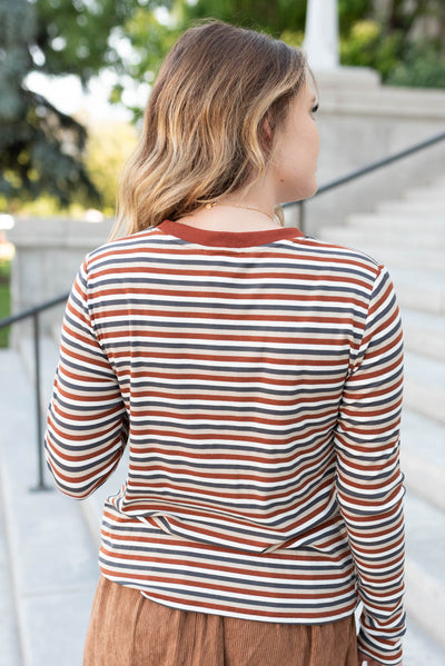 Back view of the rust stripe long sleeve top