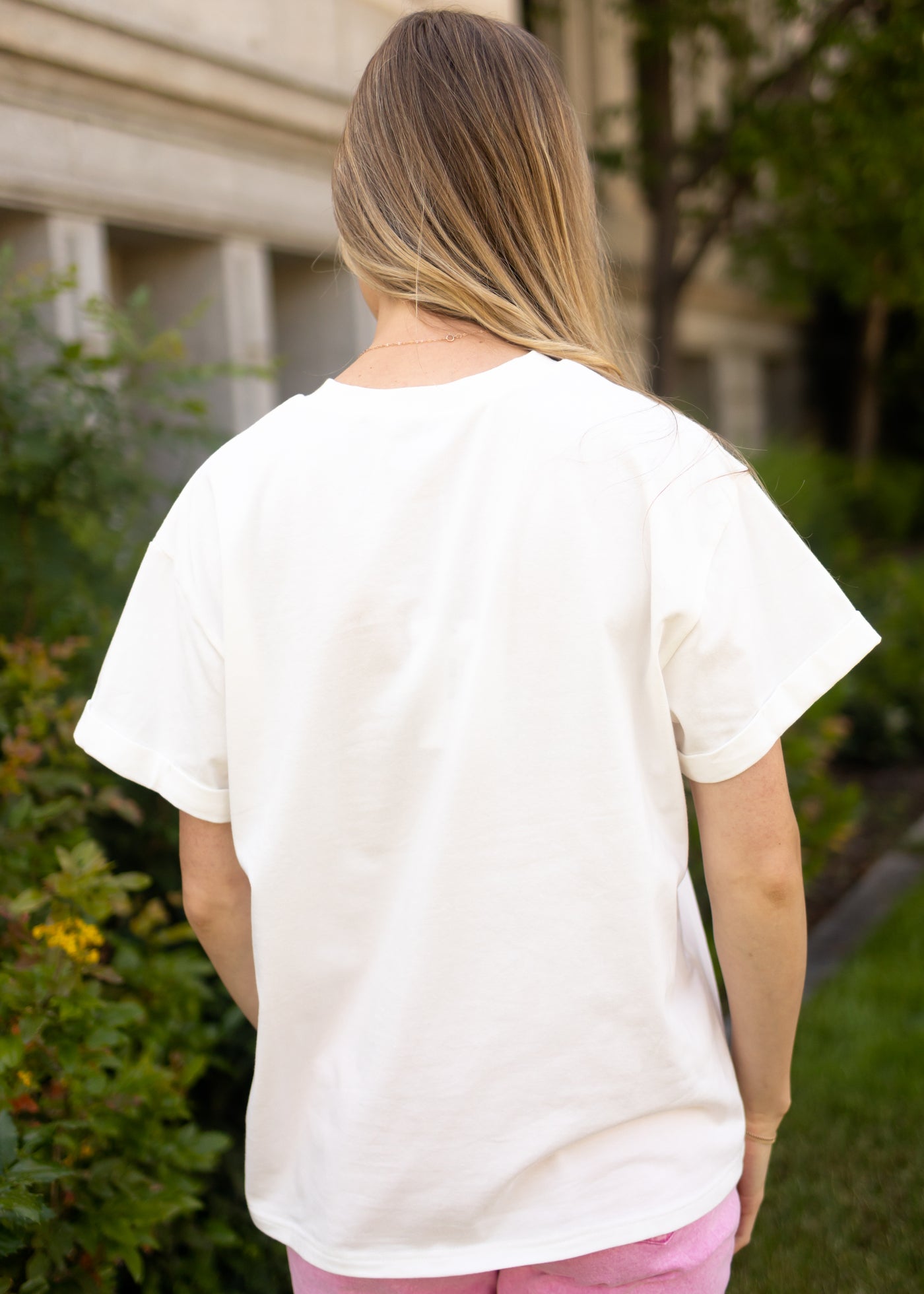 Back view of a wildflower white tee