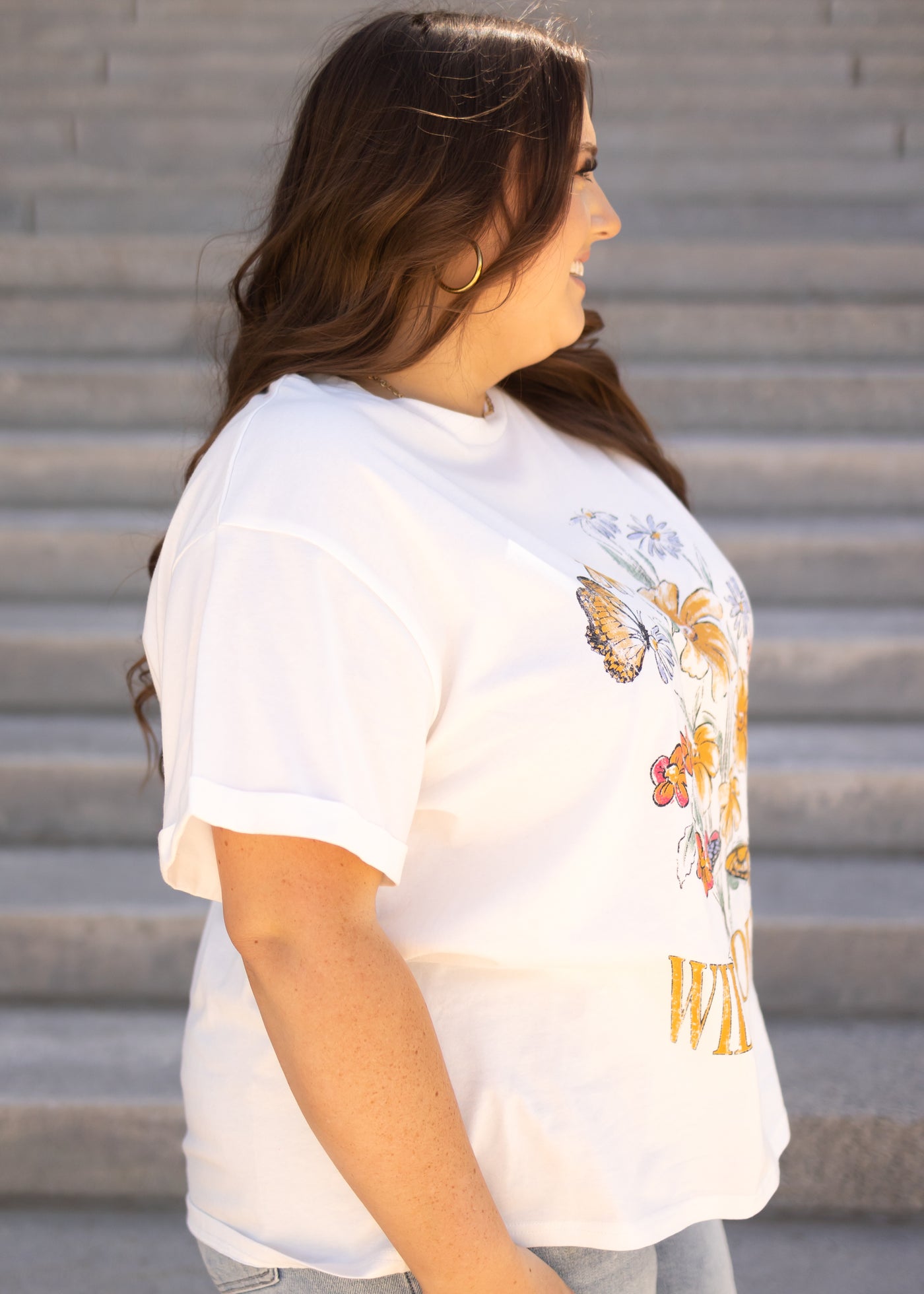 Side view of a wildflower white tee