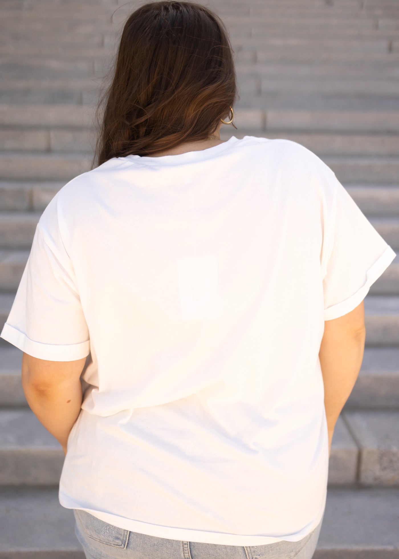 Back view of a wildflower white tee