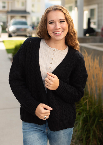 Black open knit sweater with long sleeves