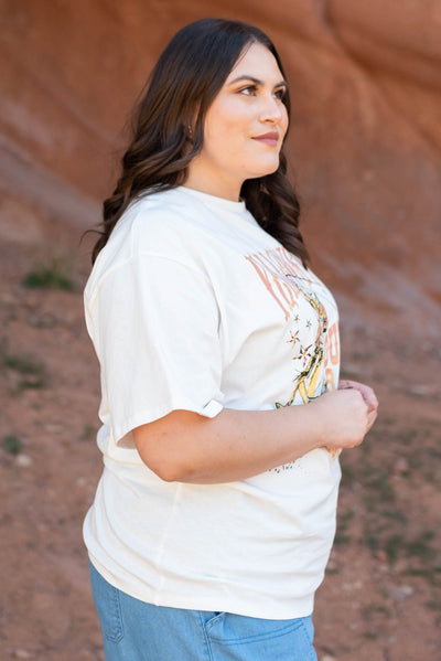 Side view of a plus size Yellowstone white tee