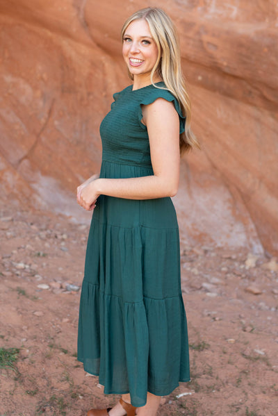 Side view of a hunter green dress