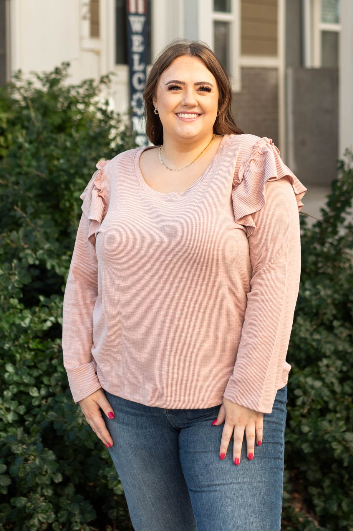 Long sleeve plus size mauve top with a ruffle at the sleeves