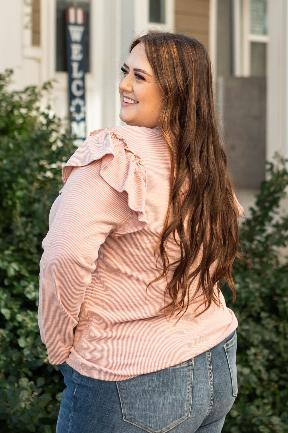 Side view of a long sleeve plus size mauve top