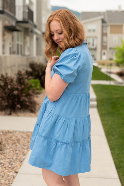 Side view of a short sleeve blue dress