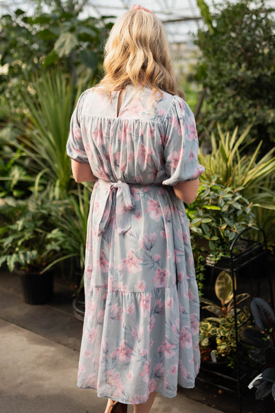 Back view of the sage grey watercolor floral dress that ties in the back