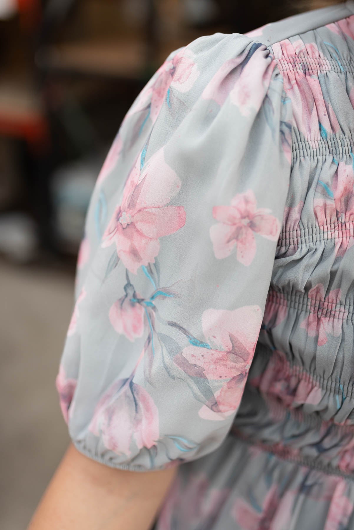 Close up of the sleeve on the sage grey watercolor floral dress
