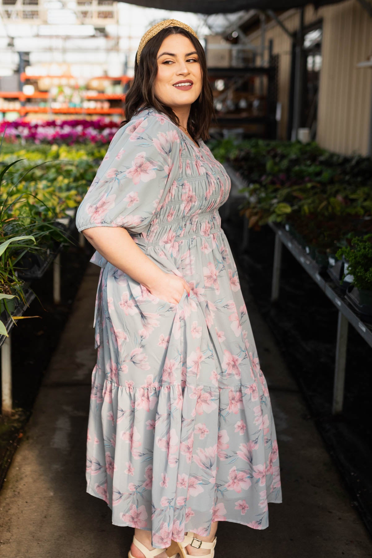 Side view of the plus size sage grey watercolor floral dress with pockets