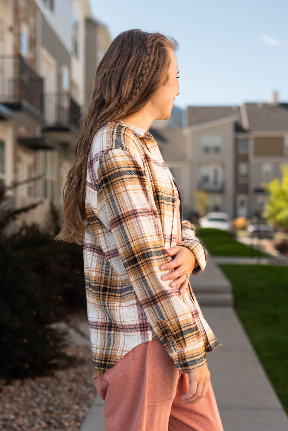 Side view of a saffron plaid top