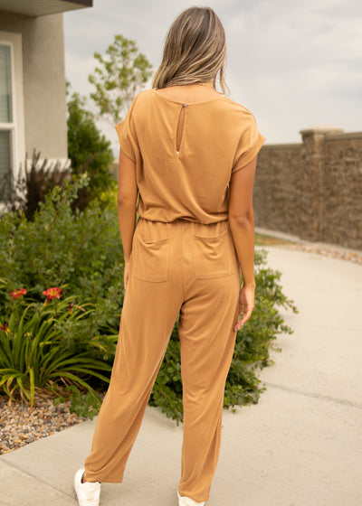Back view of a camel romper with pockets