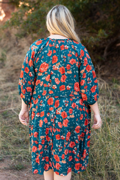 Back view of a teal floral dress