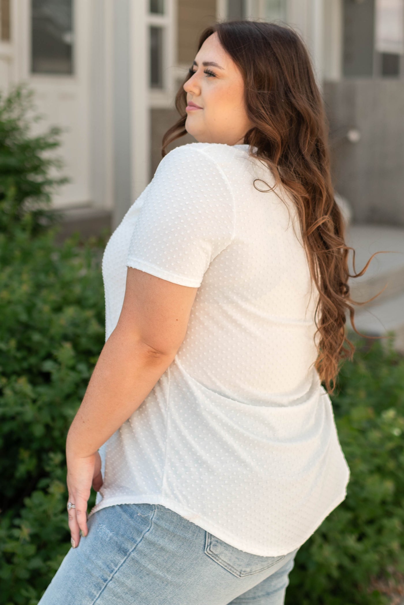 Side view of a plus size white tee