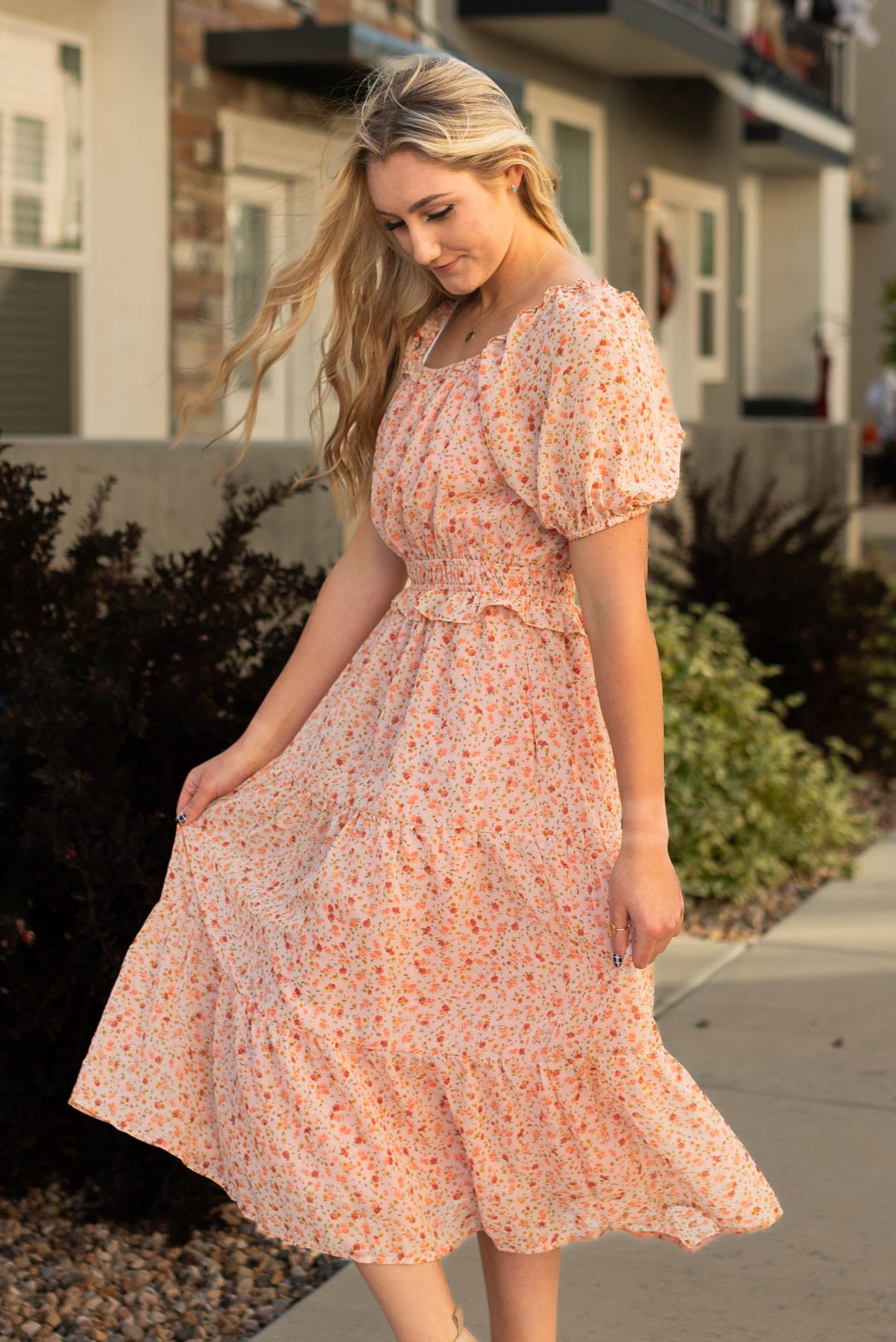 Side view of a salmon floral dress