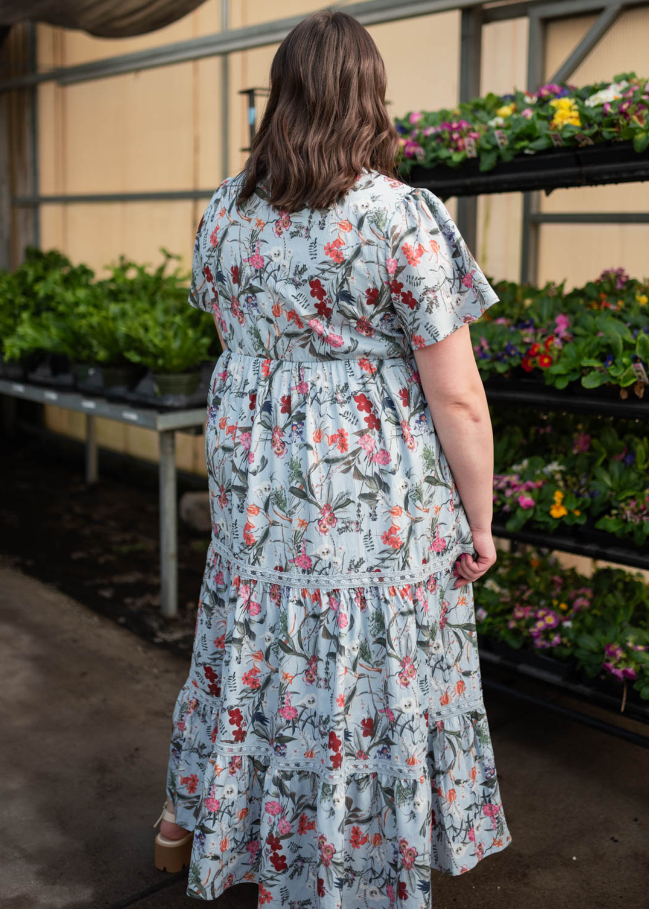 Back view of the plus size blue floral tiered dress